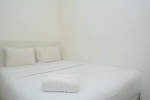 Cozy and Tidy 2BR at Signature Park Grande Apartment By Travelio