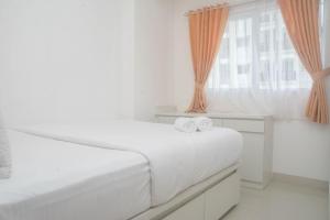 Cozy and Tidy 2BR at Signature Park Grande Apartment By Travelio