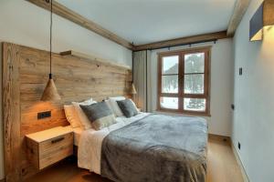 ARC 1950 - Appartement 8 personnes Duplex Cheminée - ski aux pieds - Sauna, Hammam, Jacuzzi, Piscine