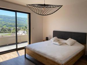 Villas Superbe Villa vue panoramique et piscine exterieure chauffee : photos des chambres