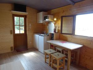 Appartements Belle roulotte de style chalet au coeur du Sancy : photos des chambres