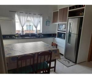 Michele casa de Praia