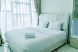 Comfort 1BR at Brooklyn Alam Sutera Apartment By Travelio