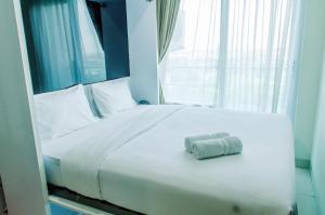 Comfort 1BR at Brooklyn Alam Sutera Apartment By Travelio