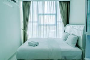 Comfort 1BR at Brooklyn Alam Sutera Apartment By Travelio
