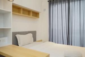 Simply and Cozy Studio at Sky House BSD Apartment By Travelio
