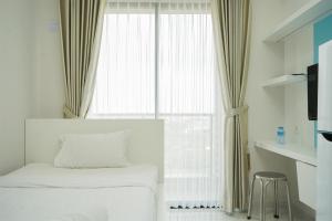 Minimalist Studio at Sky House BSD Apartment By Travelio