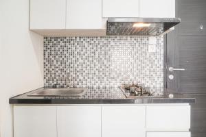 Minimalist and Homey 1BR at Belmont Residence Puri Apartment By Travelio