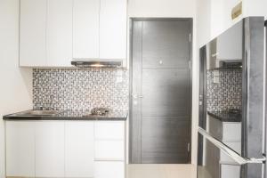 Minimalist and Homey 1BR at Belmont Residence Puri Apartment By Travelio