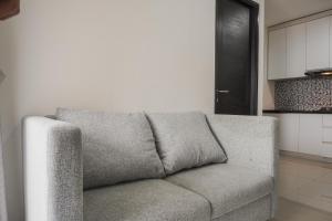 Minimalist and Homey 1BR at Belmont Residence Puri Apartment By Travelio