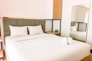 Cozy and Elegant with Pool View 2BR Apartment at M-Town Residence By Travelio