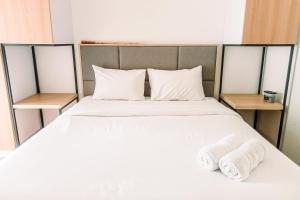 Cozy and Elegant with Pool View 2BR Apartment at M-Town Residence By Travelio