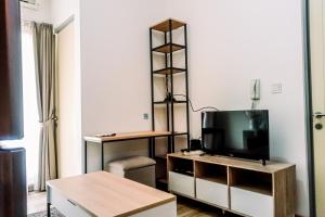 Cozy and Elegant with Pool View 2BR Apartment at M-Town Residence By Travelio