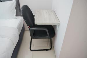 Minimalist and Nice Studio at Tree Park City Cikokol Apartment By Travelio