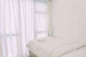 Warm and Minimalist 3BR Apartment at M-Town Residence By Travelio