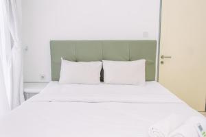 Warm and Minimalist 3BR Apartment at M-Town Residence By Travelio