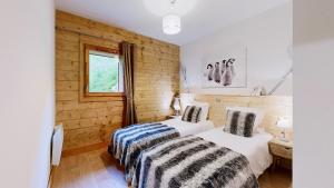 Appartements Pied des Pistes - Evasion alpine haut de gamme : photos des chambres