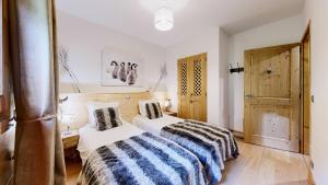 Appartements Pied des Pistes - Evasion alpine haut de gamme : photos des chambres