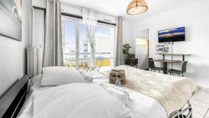 Appartements HOMEY MOSA - Au pied du Tram - Proche centre - Balcon Prive - Wifi et Netflix : photos des chambres