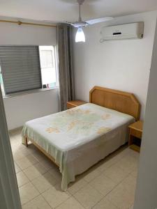 Apto em Guarujá com Aréa aconchegante privativa com churrasqueira