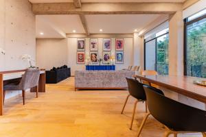 Modern Art Filled Home with Large Living Space and City Views