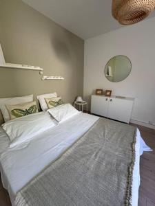 Appartements Le Marceau - Maison climatisee avec jardin : photos des chambres