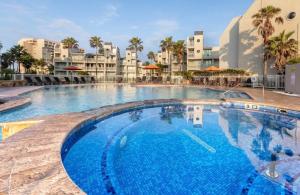 Ground level beachside condo w-Heated pool 2BR-2BA