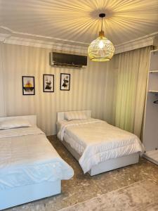 شقه فندقيه في الشيخ زايد بحديقه خاصه