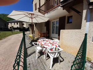 Appartements Escapade Montagne en Famille, appartement cosy avec piscine couverte : photos des chambres