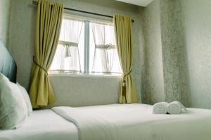 Minimalist and Comfort Living 2BR at Signature Park Grande Apartment By Travelio