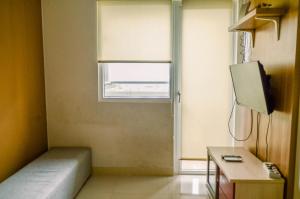 Comfort and Simple 2BR at Green Pramuka City Apartment By Travelio