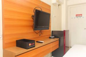 Cozy Studio at Bassura City Apartment By Travelio