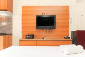 Cozy Studio at Bassura City Apartment By Travelio