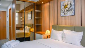 Nice and Cozy Studio at 15th Floor Evenciio Margonda Apartment By Travelio