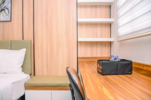 Nice and Cozy Studio at 15th Floor Evenciio Margonda Apartment By Travelio