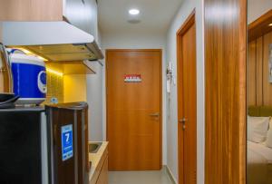 Nice and Cozy Studio at 15th Floor Evenciio Margonda Apartment By Travelio