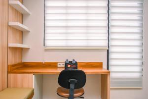 Nice and Cozy Studio at 15th Floor Evenciio Margonda Apartment By Travelio