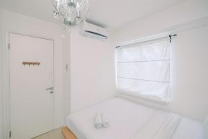 Warm and Cozy 2BR at Low Floor Bassura City Apartment By Travelio
