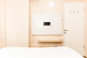 Comfort Living 1BR at Grand Sentraland Karawang Apartment By Travelio