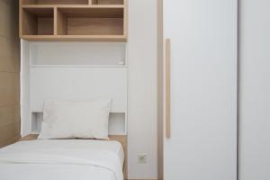 Nice and Fresh 2BR Apartment at M-Town Residence By Travelio