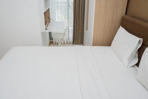 Nice and Fresh 2BR Apartment at M-Town Residence By Travelio