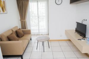 Nice and Fresh 2BR Apartment at M-Town Residence By Travelio