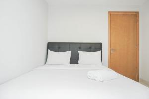 Comfy and Tidy 1BR The Mansion Kemayoran Apartment near JIEXPO By Travelio