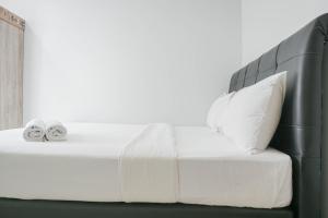 Comfy and Tidy 1BR The Mansion Kemayoran Apartment near JIEXPO By Travelio