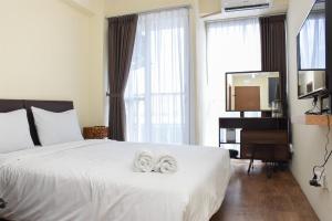 Nice and Cozy Studio at Tifolia Apartment By Travelio