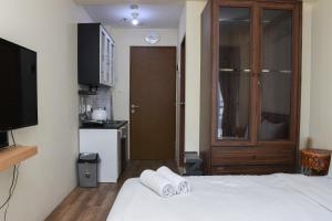 Nice and Cozy Studio at Tifolia Apartment By Travelio