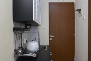 Nice and Cozy Studio at Tifolia Apartment By Travelio