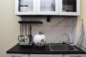 Nice and Cozy Studio at Tifolia Apartment By Travelio