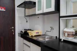Simply Monochrome and Minimalist Studio at Serpong Greenview Apartment By Travelio