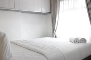 Pleasant 2BR at Grand Asia Afrika Apartment By Travelio